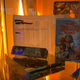 The Golden Wii, resplendent in its current home, pictured next to the crumby game it advertised.